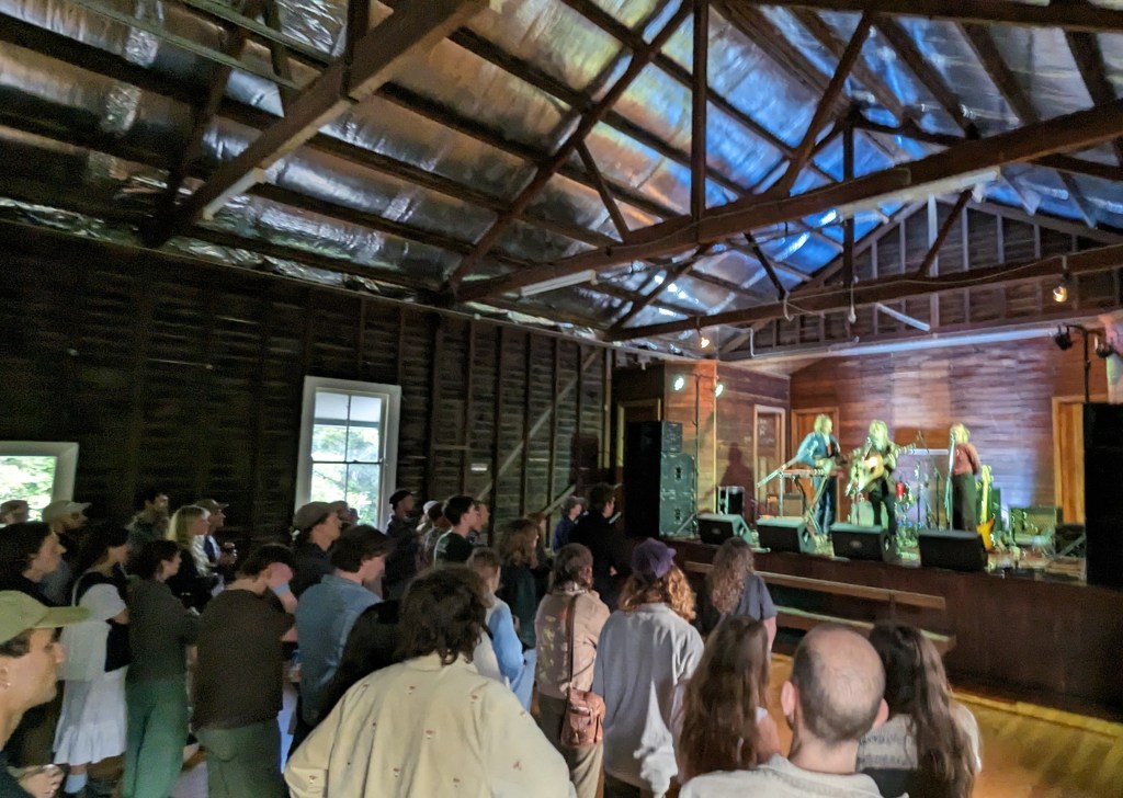 A wide shot of the interior of the hall during Leah's performance.